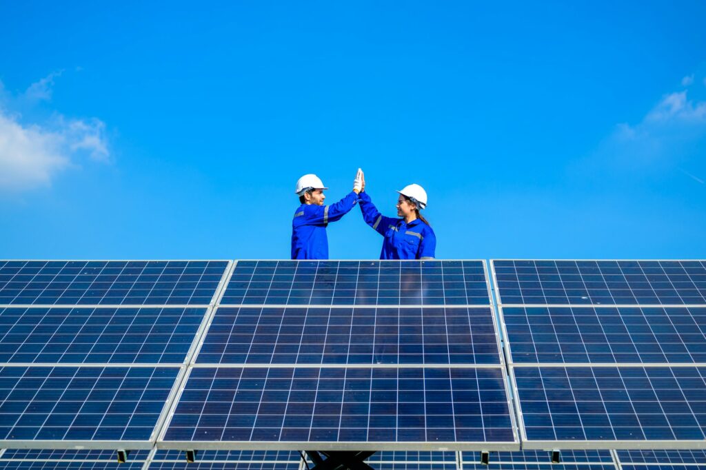 Solar panel station, Engineer installing solar panel at solar energy farm field