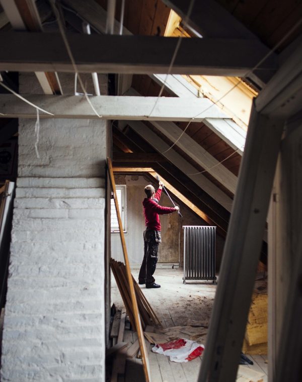 Person renovating an attic space